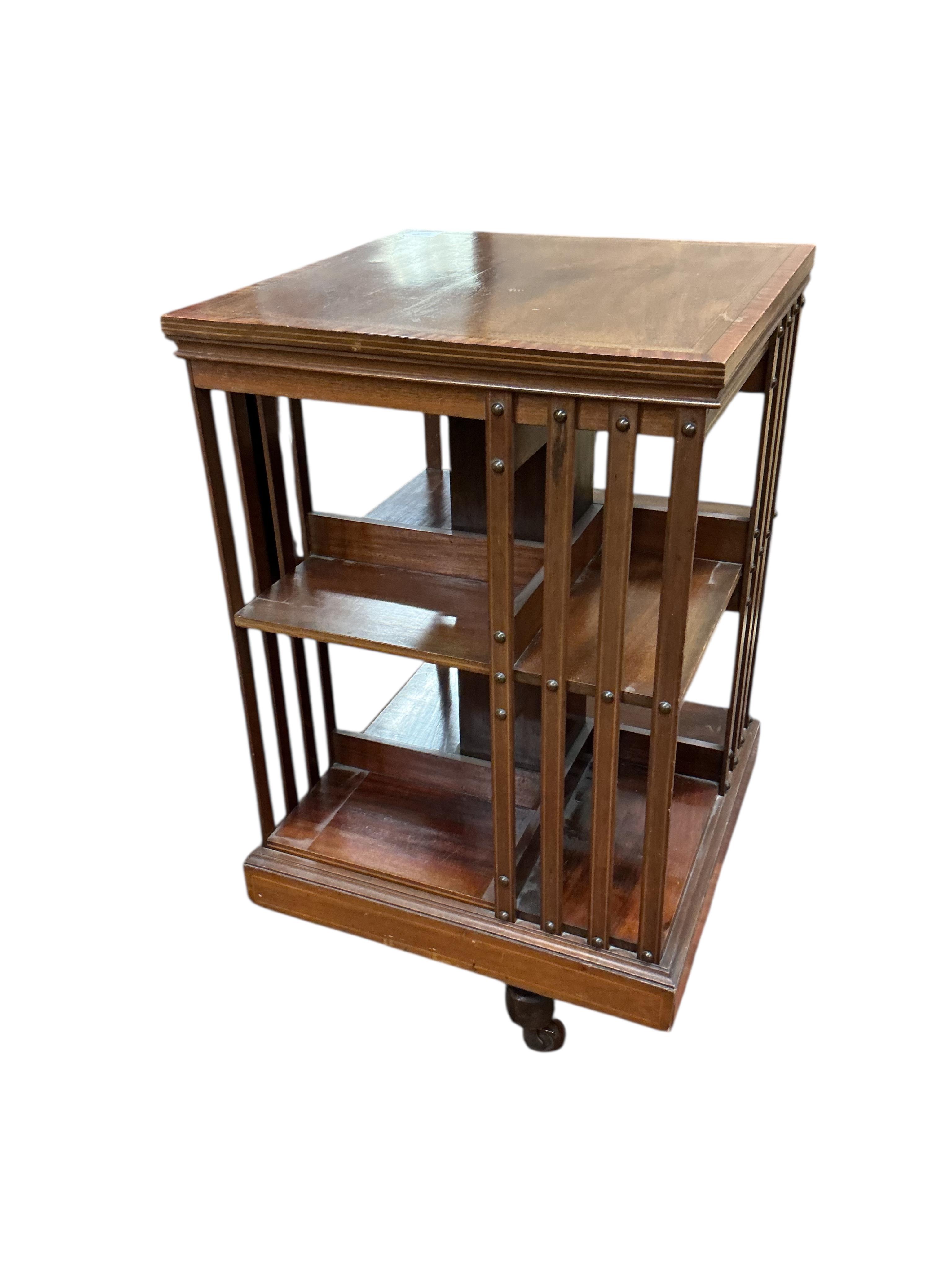 An Edwardian inlaid mahogany revolving bookcase, width 49cm, depth 49cm, height 86cm